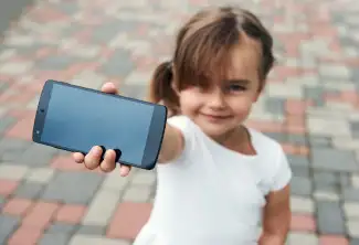 A girl holds a phone toward you